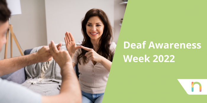 Woman and man using sign language, text to the right of the screen with a green background reads: Deaf Awareness week 2022